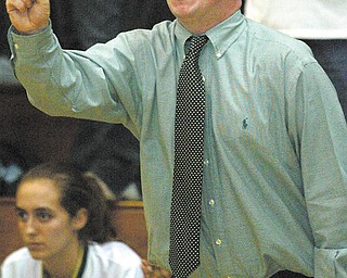 Ursuline girls basketball coach Sean Durkin signals to his girls during a 2004 game against Regina at Cuyahoga Falls. The Ursuline athletic director, Durkin will return as the Irish girls basketball coach.