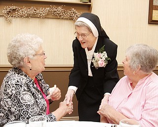 William D. Lewis\The Vindicator.William D. Lewis\The Vindicator Sister Jerome Corcoran during a June 13, 2013 event at A La Cart Caterning in Canfield. She is shown with Ruth Lind Yurcich, left, of Struthers and Anna Margaret Jackson of Boardman. Both were 4th grade students of Sister Jerome.
