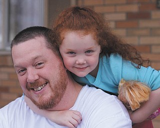 Brian Finnigan and his daughter Leah. They live in Boardman. Leah adores her dad; he doesn't hesitate to have tea parties with her, as well as teaching her to hold a bat and throw a ball. Photo was taken by Anita Carano of Boardman..