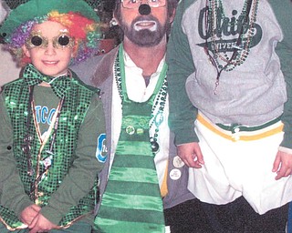 Mike "Boo Boo" Dankovich of Struthers is with his sons, Jacob, now 14, and Alec, now 9, while getting ready to clown with the Aut Mori Grotto.