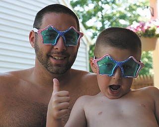 Ron Glista and his son Aaron pose for a picture on a hot summer day in 2012. They live in Boardman.
