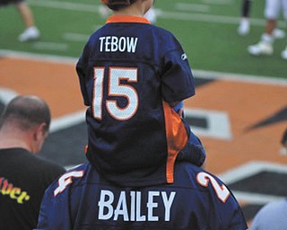 Rocco Ferreri and his son Rocco, 5, both of Austintown, enjoy an NFL football game.