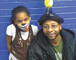 Christopher Donlow and his daughter Taylor, of Youngstown, are at her school carnival.