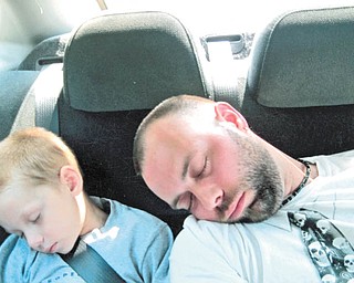 If backseat driving was their intention, then Eric Bourlier of McDonald and his son, Kyle, fell asleep on the job!
