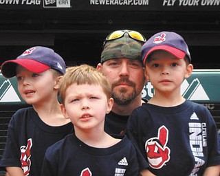 Jeremy Iftt is shown with his triplet sons, Brady, Talan and Maddox, who are celebrating their 7th birthday today! The picture was taken at a Cleveland Indians game last year. They live in Hubbard.