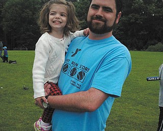 Joe Richley of Poland is with daughter Jocelyn, 2, at a recent baseball game at Rocky Ridge.
