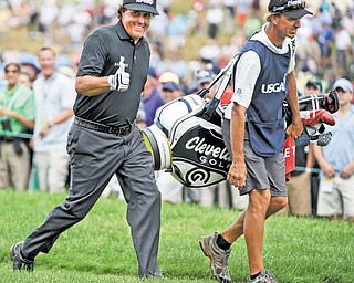 Phil Mickelson gives a thumbs up to spectators Thursday during Round 1 of the U.S. Open at Merion Golf Club’s East Course in Ardmore, Pa. Mickelson overcame major obstacles including rain and jet lag to shoot a 67 and take a one-under lead.