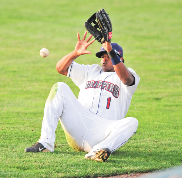 Scrappers right fielder Juan Romero falls as he attempts to reach the ball during the fifth inning of the team’s season opener Monday against the Jamestown Jammers at Eastwood Field in Niles. The Scrappers fell 5-0.