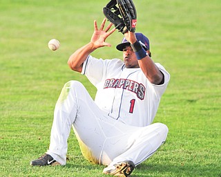Scrappers right fielder Juan Romero falls as he attempts to reach the ball during the fifth inning of the team’s season opener Monday against the Jamestown Jammers at Eastwood Field in Niles. The Scrappers fell 5-0.