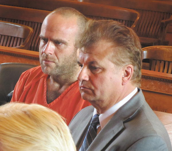 Scott H. Walker, left, of Bazetta Township stands with Matt Pentz of the Ohio Public Defender’s Office in court Tuesday.