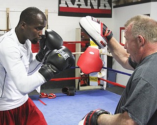 William D. Lewis\The Vindicator.Boxer Willie Nelson and trainer Jack Loew  during a 6-19-13 workout at Southside Boxing Club in Youngstown.