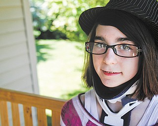 Marissa Salus, 12, at her Boardman home, was diagnosed with chordoma, a rare form of cancer that had manifested itself in her cervical vertebrae. Marissa said she’s looking forward to two benefit dinners — and has already picked out a yellow dress to wear one on Saturday at First Covenant Church, 5210 Glenwood Ave.