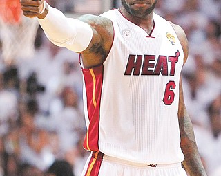 LeBron James had 37 points 12 rebounds, four assists and two steals to lead the Miami Heat to back-to-back
NBA titles on Thursday against the San Antonio Spurs at American-Airlines Arena in Miami. The Heat downed
the Spurs, 95-88, to finish the series 4-3.