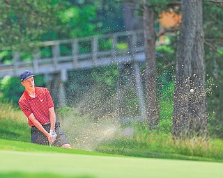 Nick Braydich of Mooney chips out of the sand trap and onto the green on the 18th hole at Monday’s Greatest Golfer of the Valley junior qualifier at Salem Golf Club.