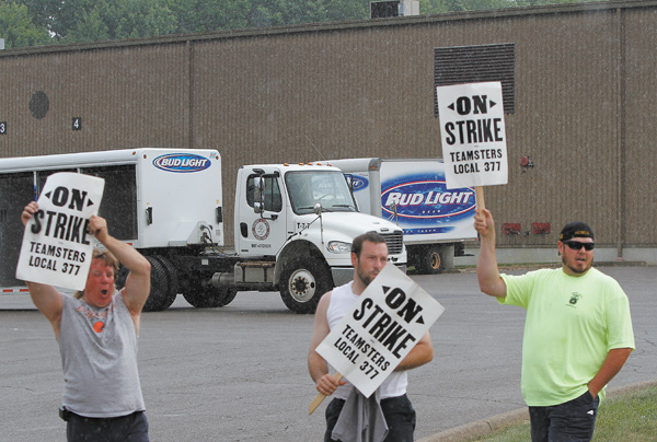 Workers at RL Lipton Distributing Co. went on strike Tuesday morning. The business continued its work
while the employees stood out front with signs.