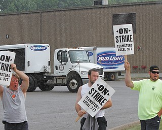 Workers at RL Lipton Distributing Co. went on strike Tuesday morning. The business continued its work
while the employees stood out front with signs.