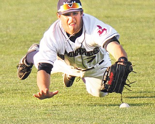 Mahoning Valley Scrappers center fielder Josh McAdams makes a diving attempt, but is unable to catch a
line drive against the State College Spikes on Wednesday night at Eastwood Field. State College defeated
Mahoning Valley, 6-1, in a New York-Penn League game.