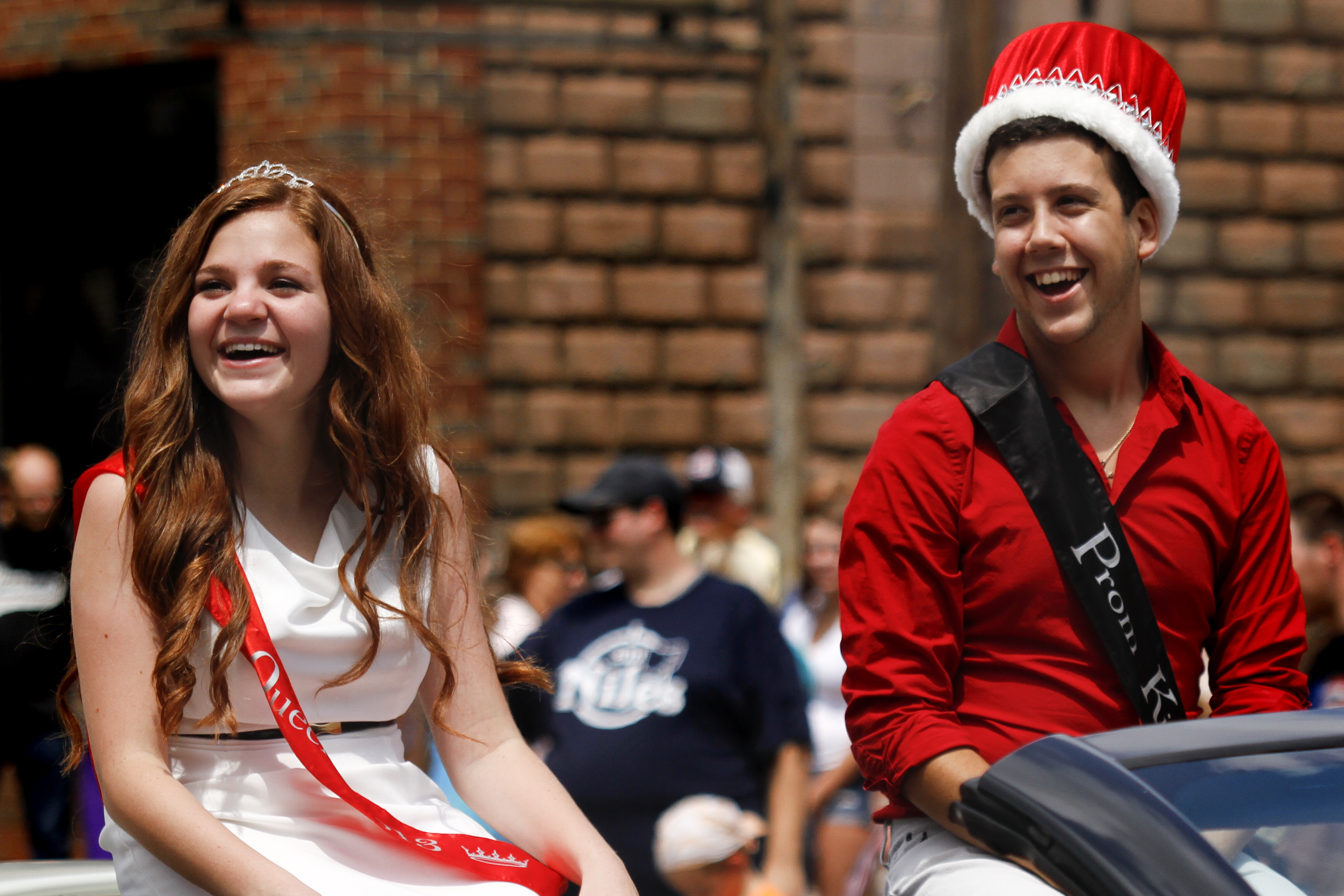 MADELYN P. HASTINGS | THE VINDICATOR

(L-R) Niles McKinley High School 2013 prom Queen and King Elizabeth Hess and Dominic Ficeti laugh during the parade at the hot dog festival in downtown Niles on Sunday.