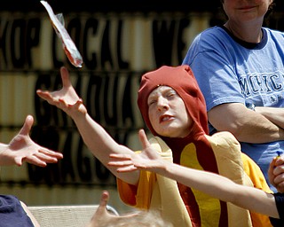 MADELYN P. HASTINGS | THE VINDICATOR

Eric Pappada, 14, reaches to catch candy while dressed as a hot dog during the parade at the hot dog festival in downtown Niles on Sunday.