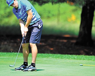 Evan Standohar of Girard watches his putt on the 11th green at the Greatest Golfer of the Valley junior qualifier at Tam O’Shanter.