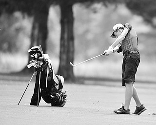 Brian Velasquez of Poland chips from the fairway onto the green on the 11th hole at Tam O’Shanter Golf Course during the Greatest Golfer junior qualifier. He shot an 89.