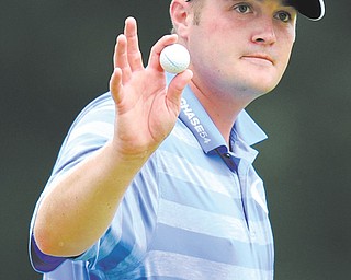 Warren’s Jason Kokrak acknowledges the gallery after finishing Sunday’s final round of the AT&T National golf tournament on the 18th green at Congressional Country Club. Kokrak shot a 2-under 69 Sunday to finish tied for third in the tournament.