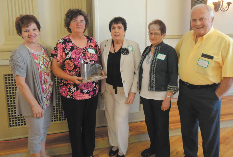 SPECIAL TO THE VINDICATOR
The Historic Preservation Society of the Mahoning Valley Historical Society Board of Trustees presented the 2013 Community Revitalization Award to Girard Historical Society at its annual awards program June 18. Girard Historical Society members, from left, are Roselyn Gadd, Roberta Lawrentz, Mary Anne Creatore, and Colette and Ralph Chuey. The award was for the group’s work for restoration, reconstruction and preservation of the Henry Barnhisel House in Girard, which is open to the public on the second and fourth Sundays of each month. Mementos can be purchased. Donations are accepted. For information visit www.girardhistoricalsociety.org.
