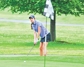 Bailey Hardick of Canfield watches her ball break toward the cup after a chip shot on the seventh hole at Diamond Back Golf Course during Monday’s junior qualifier for the Greatest Golfer of the Valley tournament. Three girls qualified for the final, which is set for July 28 at Trumbull Country Club.