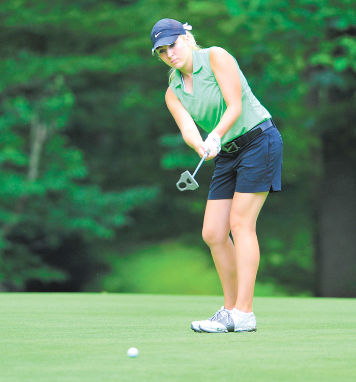 Alexa Tringhese of Columbiana watches her ball break toward the cup on the 14th hole at Diamond Back Golf Course in Canfield during Monday’s junior qualifier for the Greatest Golfer of the Valley tournament.