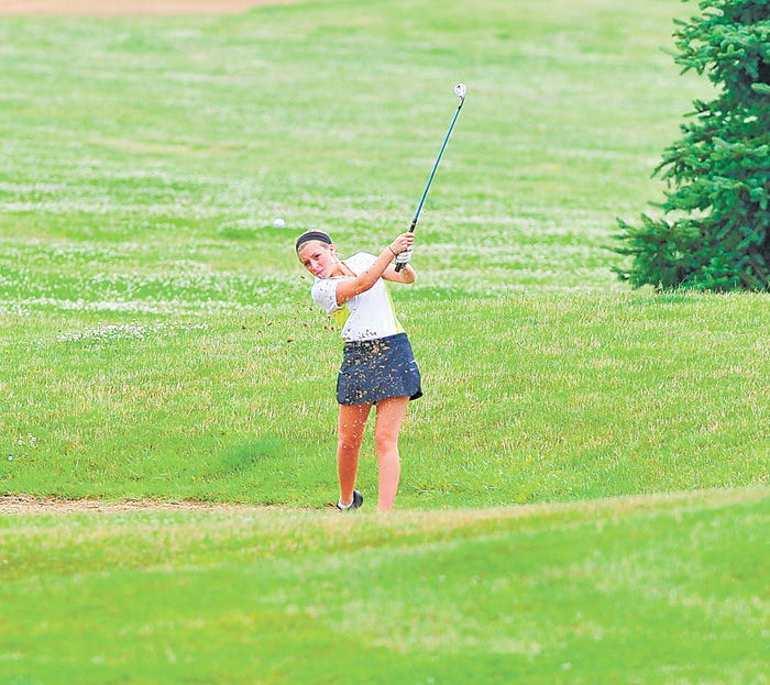 Gina Cerimele of Canfield chips her ball out of a wet sand trap and toward the green on the seventh hole at Diamond Back Golf Course in Canfield during Monday’s junior qualifier for the Greatest Golfer of the Valley tournament.