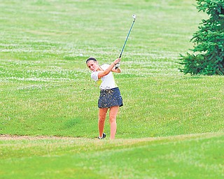Gina Cerimele of Canfield chips her ball out of a wet sand trap and toward the green on the seventh hole at Diamond Back Golf Course in Canfield during Monday’s junior qualifier for the Greatest Golfer of the Valley tournament.