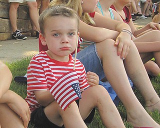 All decked out in red, white and blue; it's a tough job waiting for the parade to start. Submitted by Joyce Shaffer.