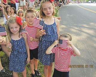 All smiles, or hiding, as the parade nears. Submitted by Joyce Shaffer.