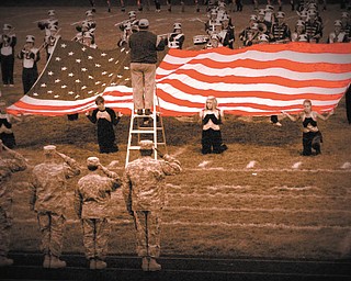 Heather Kesling of Champion, took this photo at one of the high school football games this past season where a tribute was given to our military.