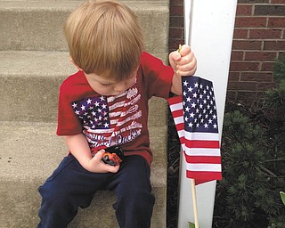 This is Cole Steiner planting a flag by the steps. He was two in this photo (12-31-10) and lives in North Canton, Ohio. His parents are Zak and Arin Steiner, originally from Girard and Champion. Sent by grandmother, Sharon Johnston of Austintown.