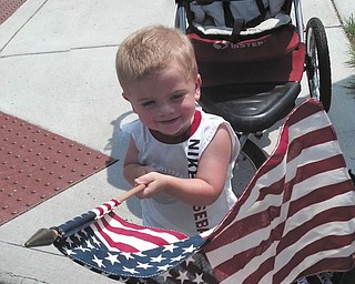 This cutie is really enjoying waving our red, white and beautiful flag!