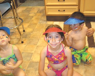 Getting ready for the Struther's Fourth of July Parade in 2012 which passes by MaMa Deem's house are Sadie Jones of Youngstown and Corinne and Joshua Deem, both of Boardman. Submitted by Dee Deem of Struthers, their grandmother.