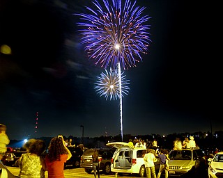 MADELYN P. HASTINGS | THE VINDICATOR

Spectators fill the streets and parking lots of downtown Youngstown to watch the firework display shot from the Covelli Centre on July 4, 2013.