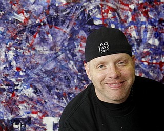 MADELYN P. HASTINGS | THE VINDICATOR

Jeff Sanders uses his wheelchair to make a painting. He will sell it in a couple of months and donate money to the  Warren Family Mission. He’s a recovering addict himself and has been staying at the mission.