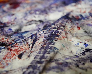 MADELYN P. HASTINGS | THE VINDICATOR
Jeff Sanders uses his wheelchair to make a painting. He will sell it in a couple of months and donate money to the Warren Family Mission. He’s a recovering addict himself and has been staying at the mission.