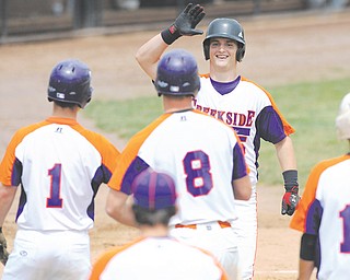 Creekside’s Zac Miller (15) is congratulated by teammates, including Harrison Wagner (1) and Brandon Ritchie (8) after hitting a solo home run in second inning of Game 1 of their Class B semifinal doubleheader against Toyota of Warren on Thursday at Cene Park in Struthers. Creekside won both games, 6-3 and 4-3, to advance to the championship against the Astro Falcons.