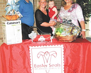 SPECIAL TO THE VINDICATOR
Easter Seals eighth annual Auction at Margaritaville will take place at 6 p.m. July 19 at St. Michael Family Center in Canfield. Representatives of Easter Seals, above, are Ken Sklenar, president and chief executive officer; Jodi Harmon, development and personal relations director; Meredith Wakefield of Boardman, who attends the center and receives occupational and speech therapy; and Mary Ann Carano, chairwoman of the board of directors.