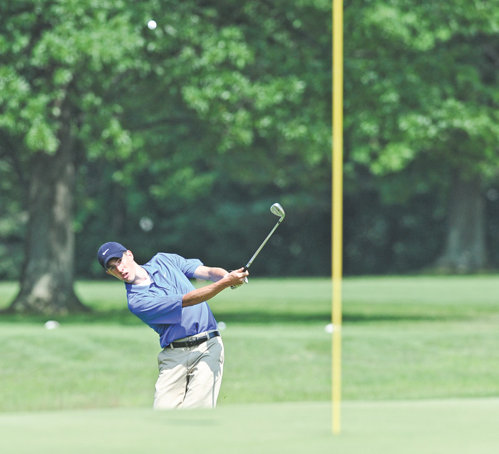 Michael McCarthy of Boardman chips his ball onto the green from the rough on the 5th hole at Tamer Win in Cortland.