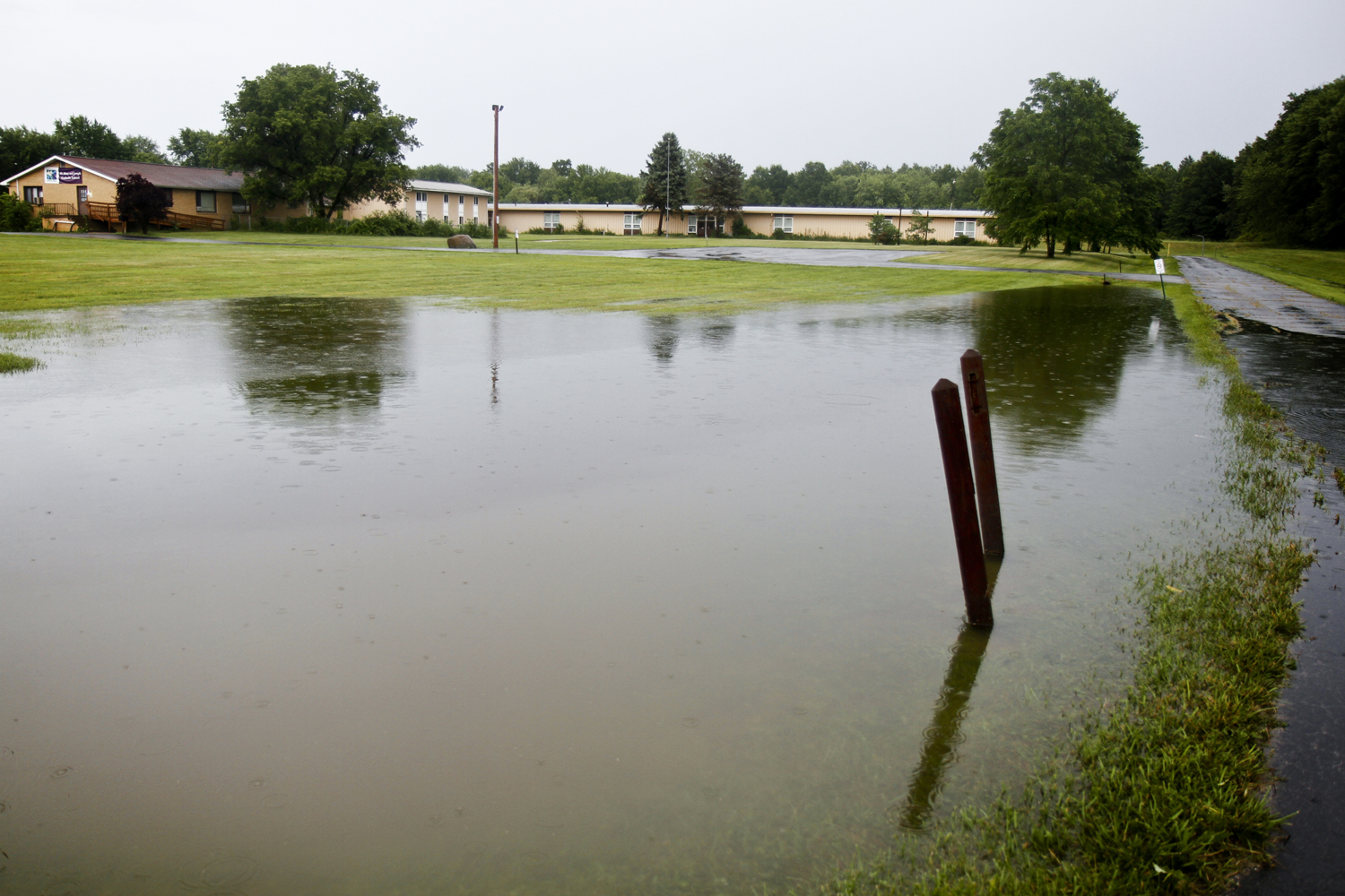 MADELYN P. HASTINGS I THE VINDICATOR

Flooding struck the lawn of SS Mary and Joeseph School in Newton Falls after a storm on July 10, 2013. 