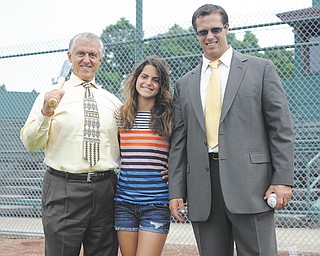 Serena Sammarone, center, placed ninth nationally in her age division in Major League Baseball’s “Pitch, Hit and Run” competition. She is the daughter of former Youngstown State football player Chris Sammarone, right, and the granddaughter of Youngstown Mayor Charles Sammarone.
