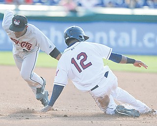 The Scrappers’ Claudio Bautista (12) is tagged out by Tri-City second baseman Tony Kemp while trying to steal in the second inning of the first game of a doubleheader Thursday night.