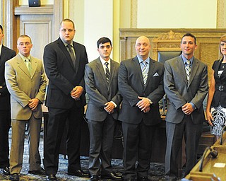 Youngstown Police Chief Rod Foley, left, and Mayor Charles Sammarone, right, flank seven new police officers who were sworn in Monday, who are, in no particular order, Brian Ferreri, Thomas Wisener, Timothy Edwards, Stephen Gaetano, Hannah Banks, Daniel Zakrajsek and Kenneth Garling.