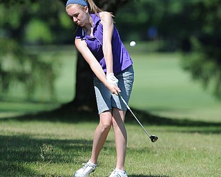 Sydney Heinbaugh of Youngstown chips out of the short rough and onto the green on the third hole Friday morning at Tamer Win in Cortland.