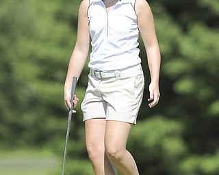 Nicolette Eddy of Niles smiles after sinking a long putt on the 3rd hole Friday morning at Tamer Win in Cortland. 