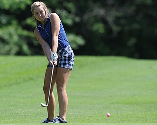 Haley Dean of of Cortland chips her ball from the short rough and onto the green on the 8th hole Friday morning at Tamer Win in Cortland.